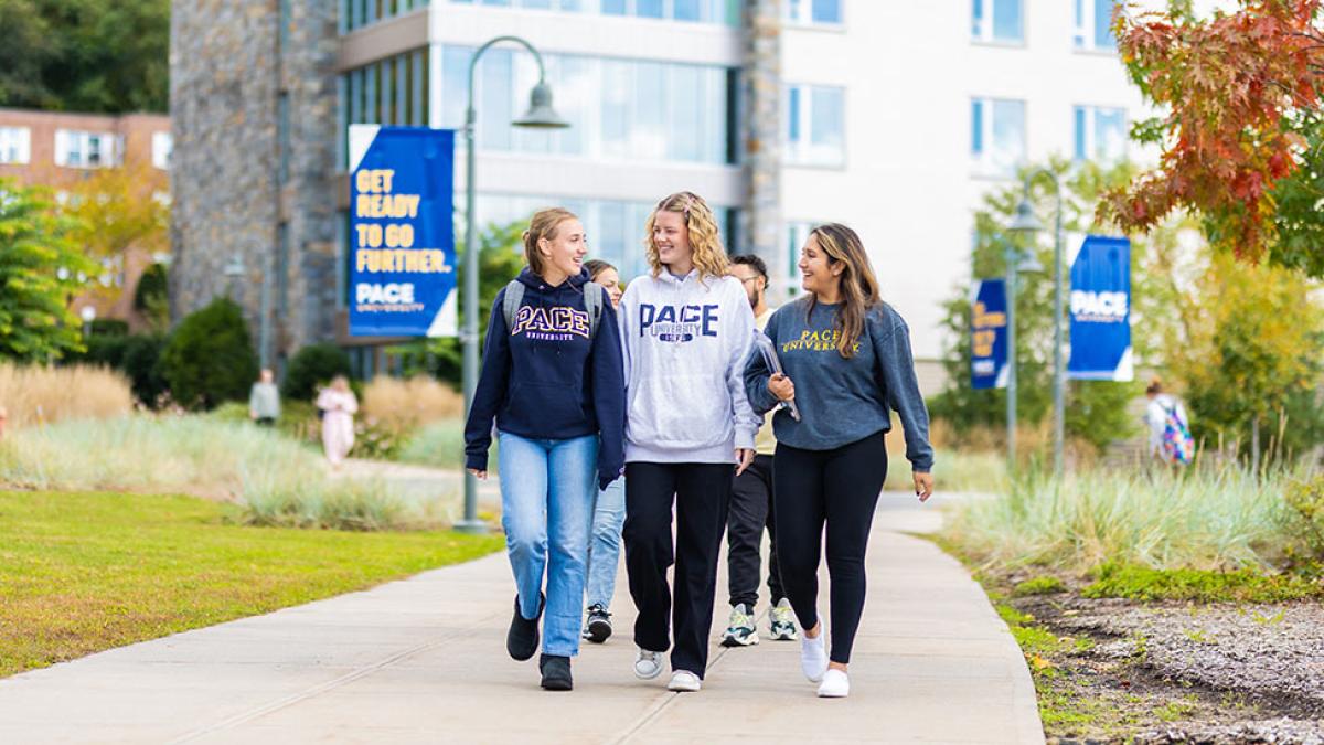 Three pace university students walking on the Pleasantville campus.