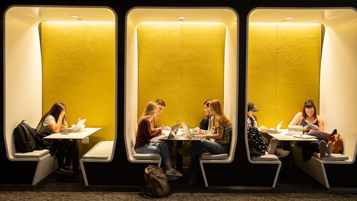 Pace university students studying in cubby benches on the NYC campus