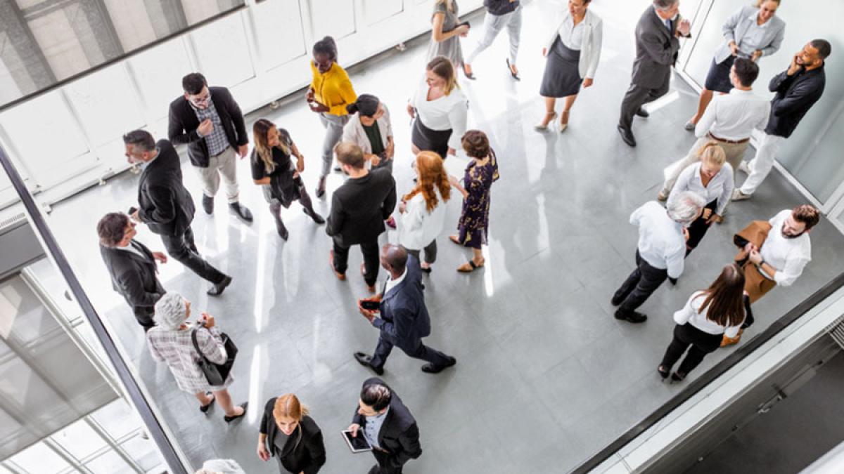 aerial view of a group of business people standing in a lobby