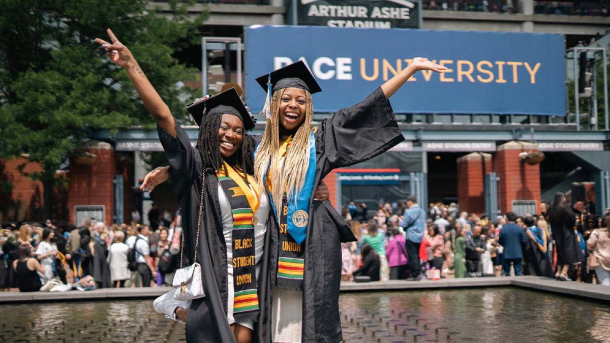 grads posing at commencement. 