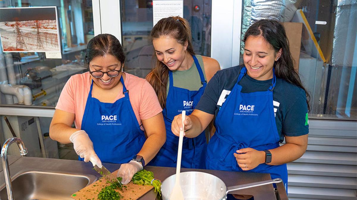 Students cooking at the Nutrition and Dietetics Teaching Kitchen at Pace University.