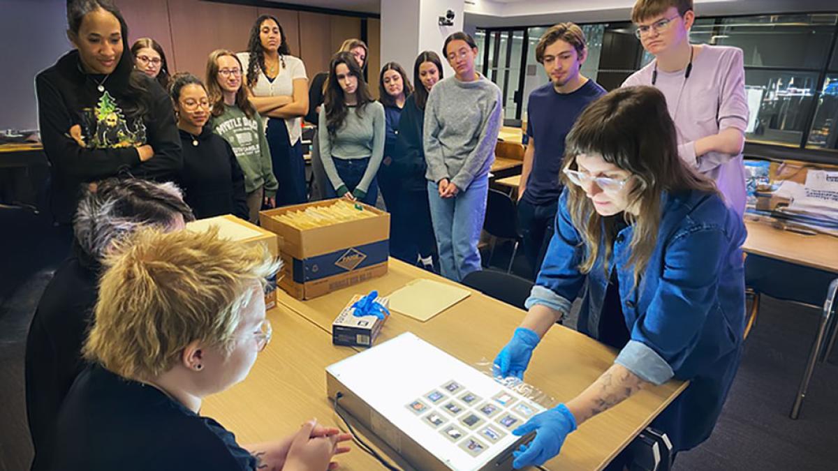 Pace University's Associate Professor of History Michelle Chase, PhD, and her students look at significant events in Latin America together through NACLA’s film slide archives on a lightboard.