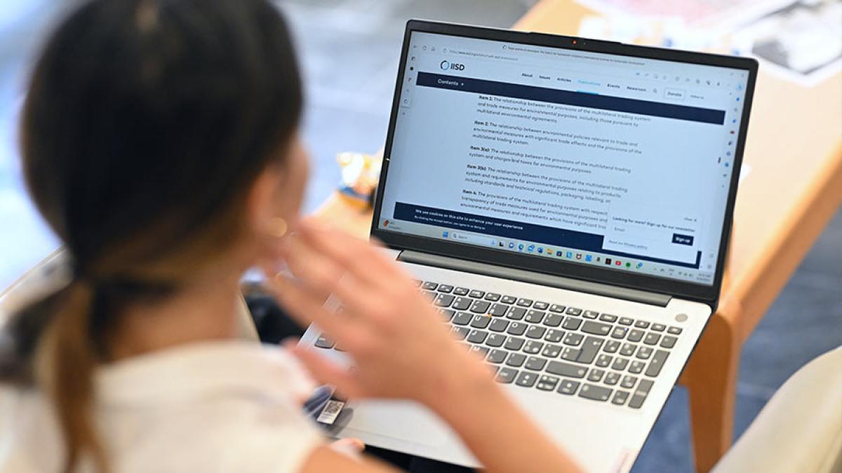 Woman working with open laptop