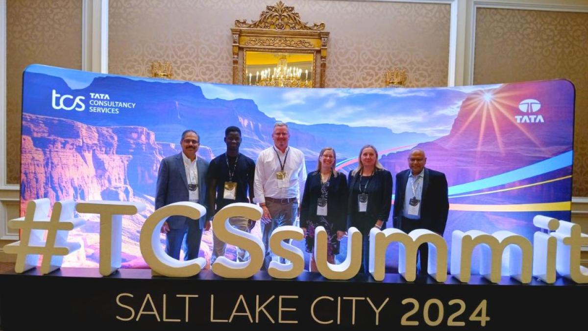 Pace University Seidenberg School of CSIS Professor Dr. Christelle Scharff (2nd from right) posing for a photo with industry partners at the TCS Summit in Salt Lake City.