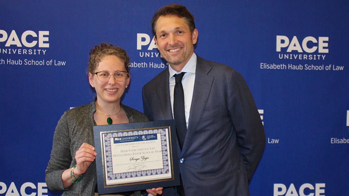 Sonya Ziaja, Assistant Professor at the University of Baltimore School of Law receiving The Haub Environmental Law Distinguished Junior Scholar Award presented by Professor Jason Czarnezki, Elisabeth Haub School of Law at Pace University