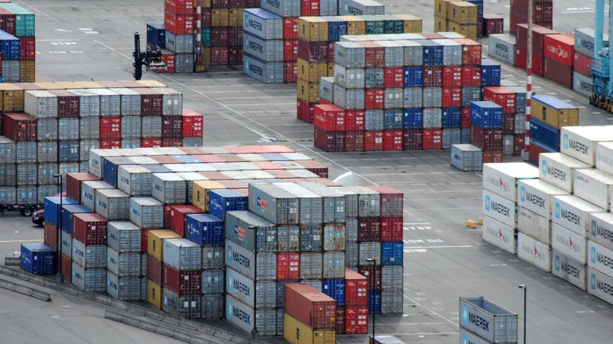 shipping containers stacked on a dock