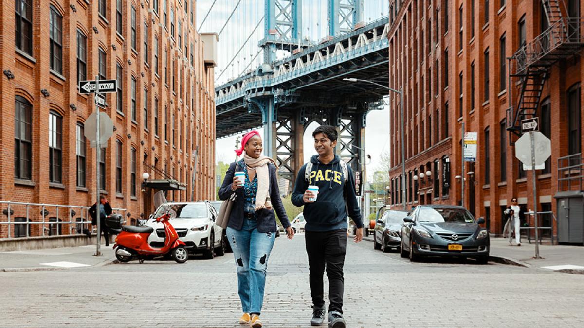 Two Pace University students walking in lower Manhattan.