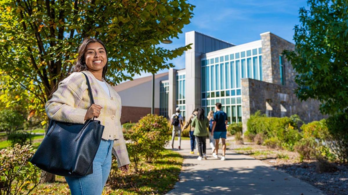 Student walking outside on Pace's Pleasantville Campus