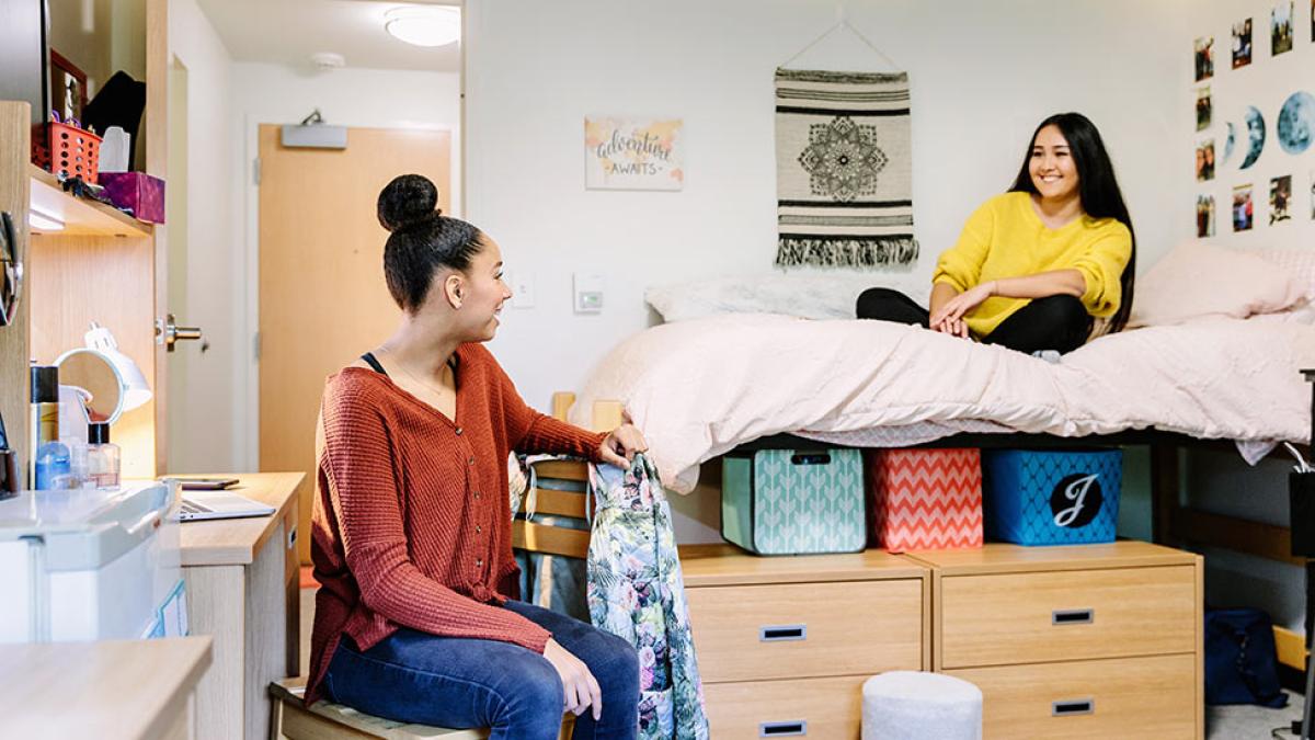 two students in a Pace University dorm room