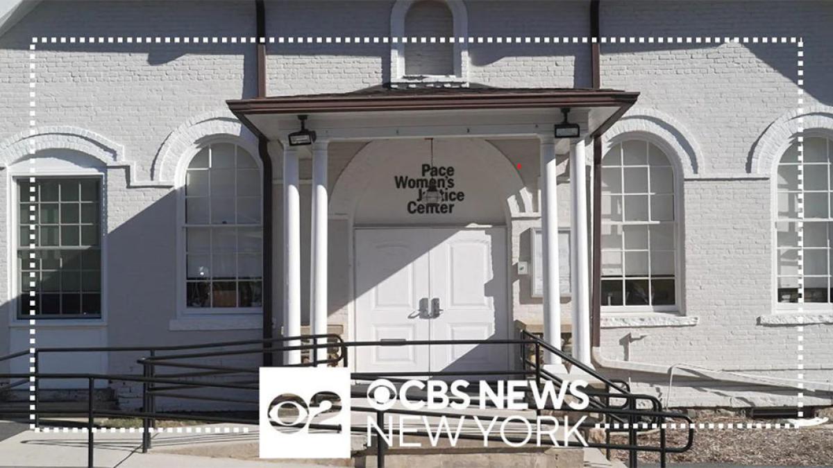 The front of the women's justice center building in White Plains is shown with an overlay of the CBS News logo and frame.