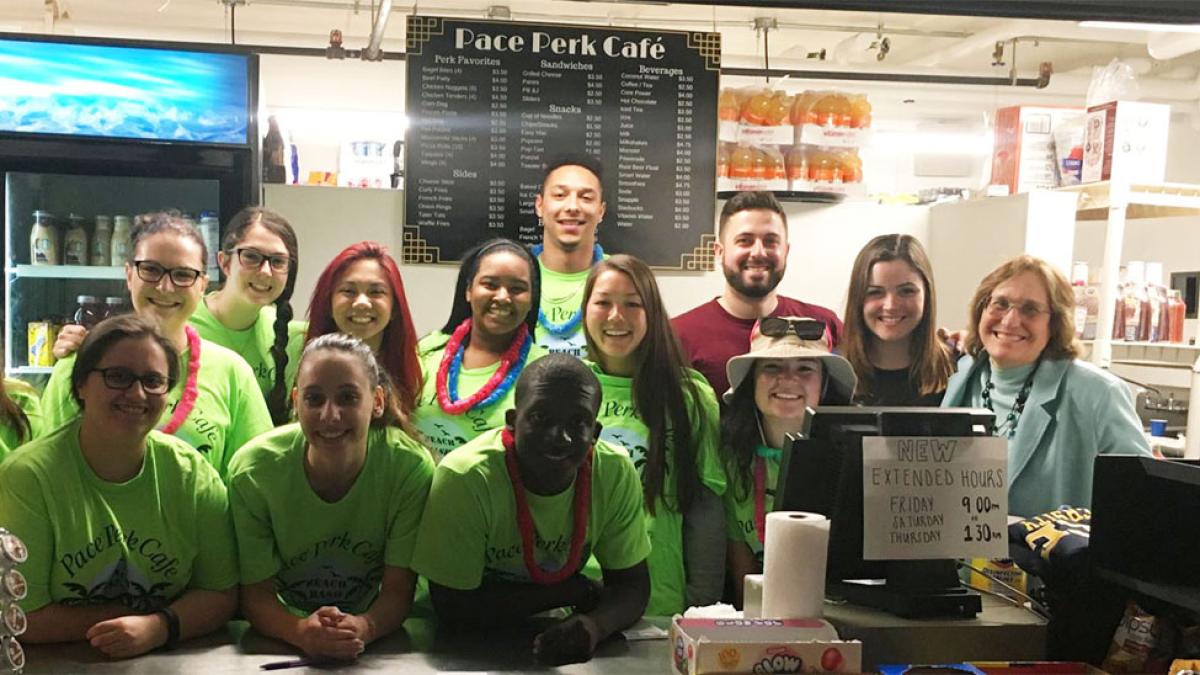 Pace University Lubin School of Business student employees of student-run business Pace Perk Cafe with Professor Kathy Winsted on the Pleasantville Campus
