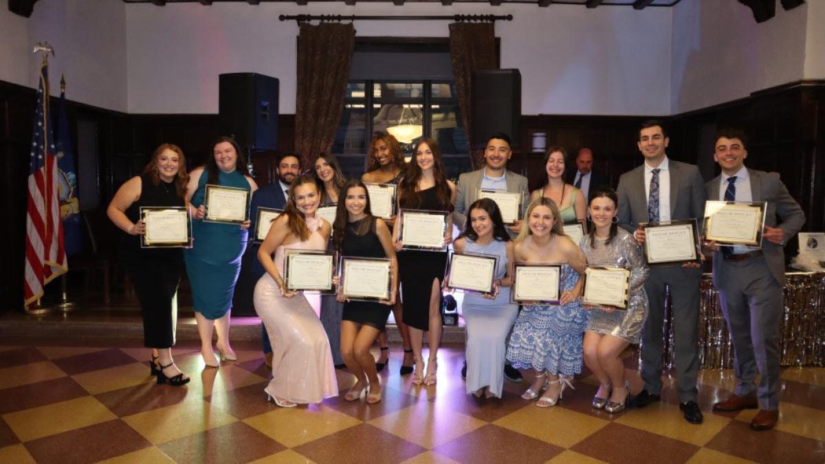 Elisabeth Haub School of Law at Pace University students standing in the Tudor Room at the 2025 Advocacy Affair