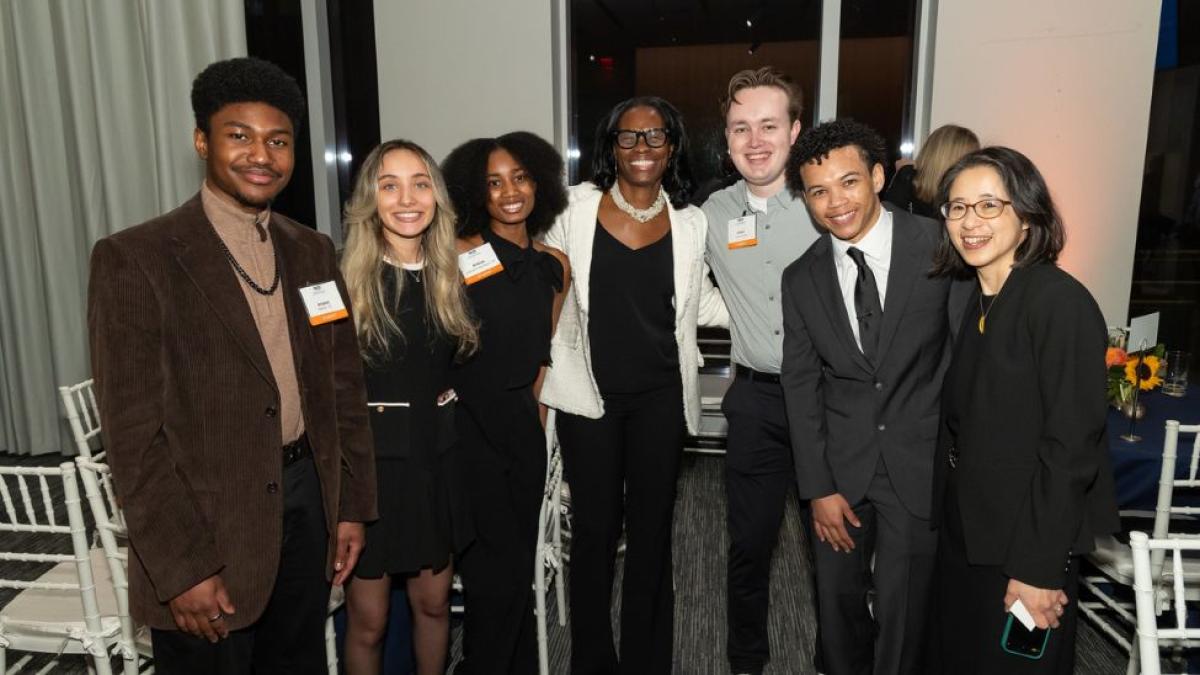 Seidenberg students posing for a photo with SIA 2025 honoree Yolanda Stancil and Seidenberg interim dean Li-Chiou Chen.
