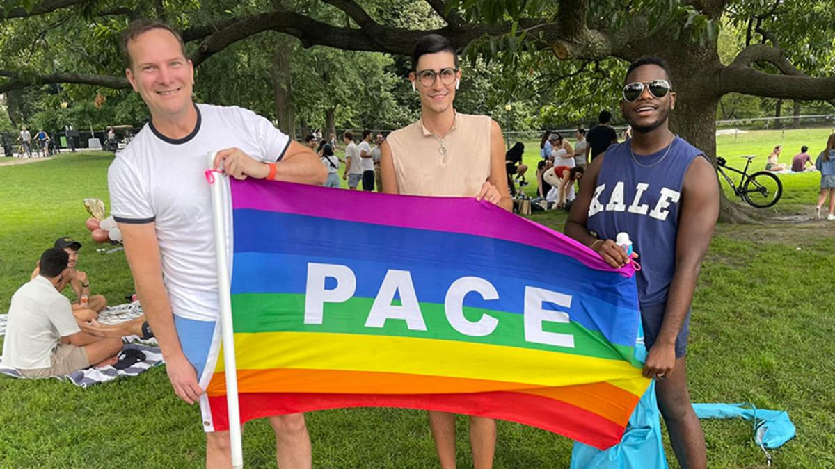 Group of Pace University part of the Pace Pride Network affinity group, smiling at the camera.