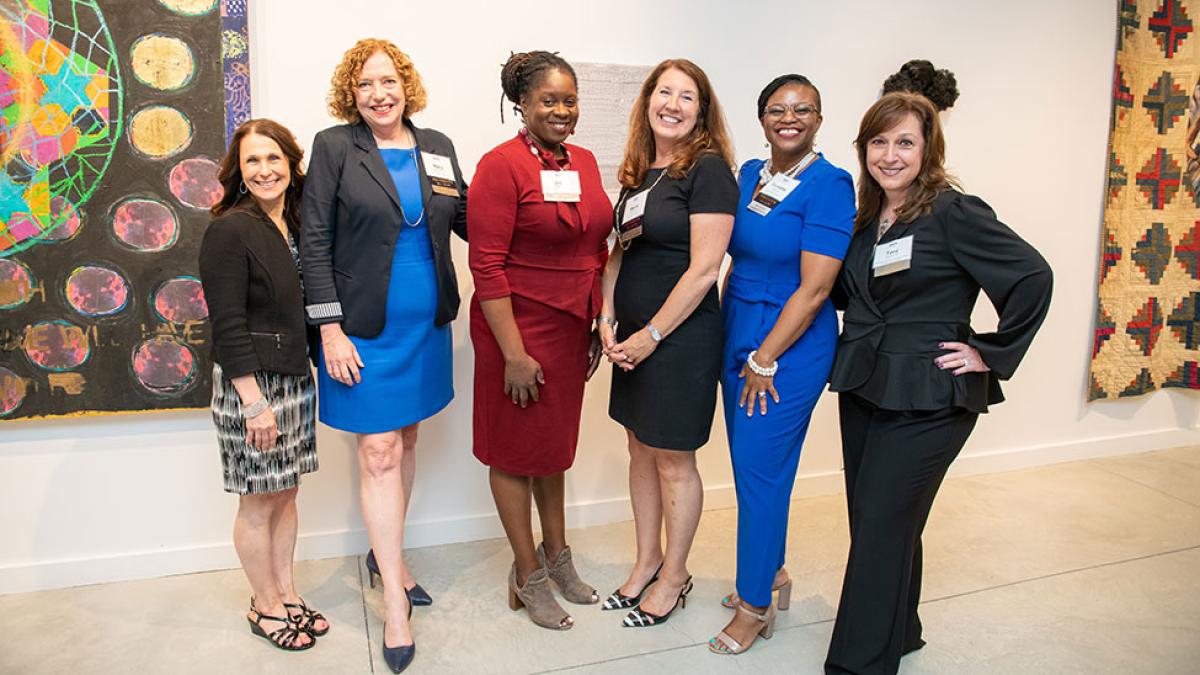 Pace University alumni part of the Pace Women's Network affinity group smiling at the camera.