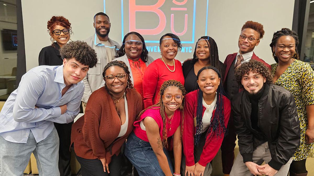 Group of Pace University alumni part of the Black Alumni affinity group, smiling at the camera.