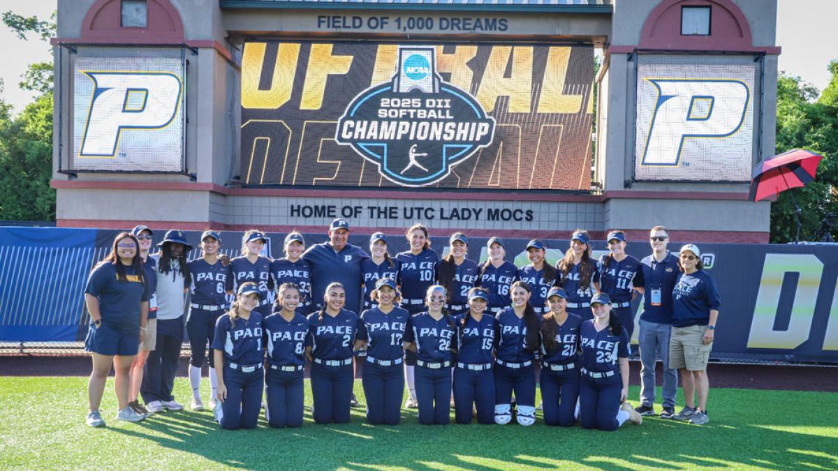 Pace Softball team posing after their winning game.