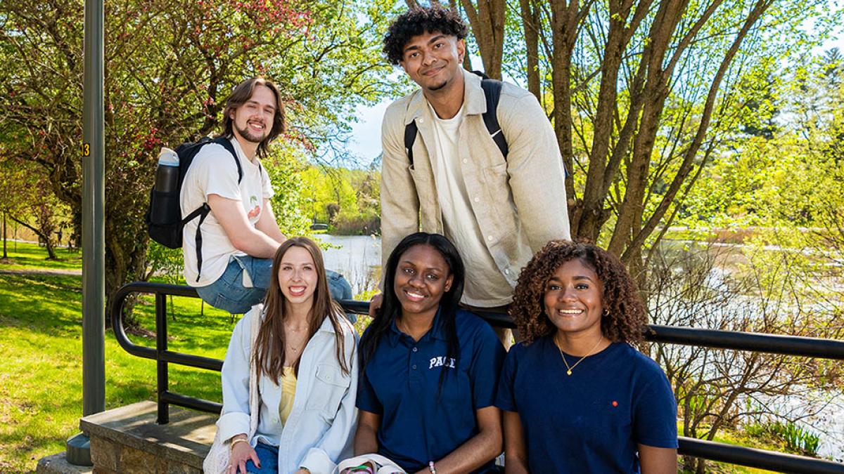 Pace students smiling for the camera on the Pleasantville campus