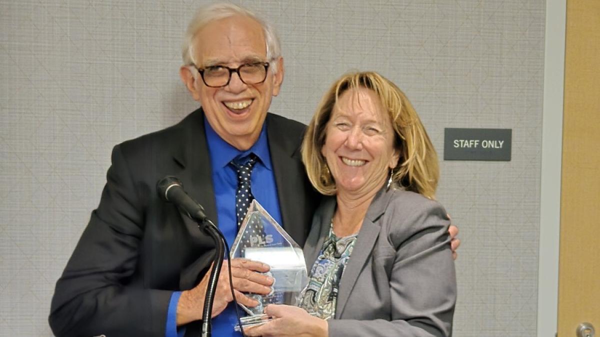 Elisabeth Haub School of Law at Pace University Professor Emeritus Michael Mushlin receiving the John R. Dunne Chamption of Justice Award