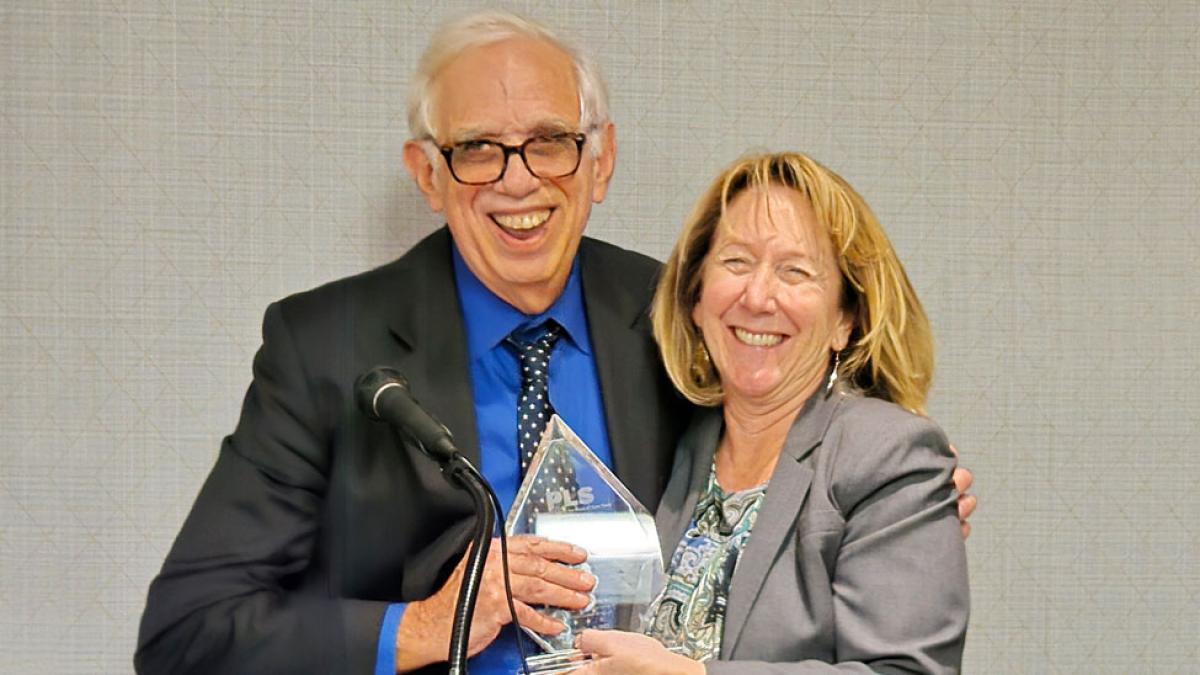 Elisabeth Haub School of Law at Pace University Professor Emeritus Michael Mushlin receiving the John R. Dunne Chamption of Justice Award