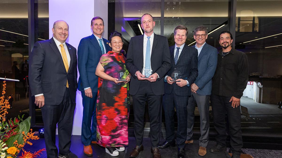 Group of Pace University alumni smiling at the camera at the Pace Celebrates: Changemakers event.