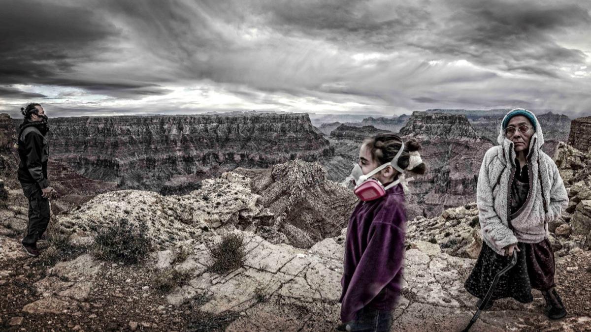 Artwork showing mountains and a few people with gas masks by Will Wilson on view in the Pace University Art Gallery's Nuclear Injustice exhibition