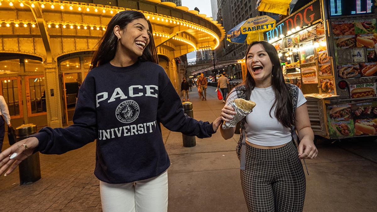 Two Pace University students walk through Manhattan