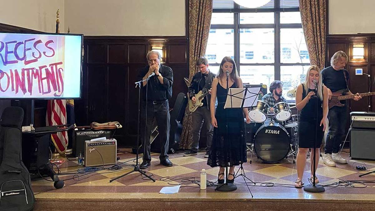 Elisabeth Haub School of Law at Pace University faculty and staff playing in campus band for annual Earth Day celebration