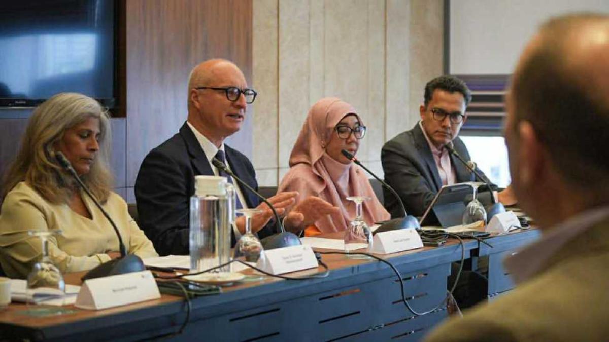 Dr Somasundaram, and other panelists listening as the WHO Envoy speaks