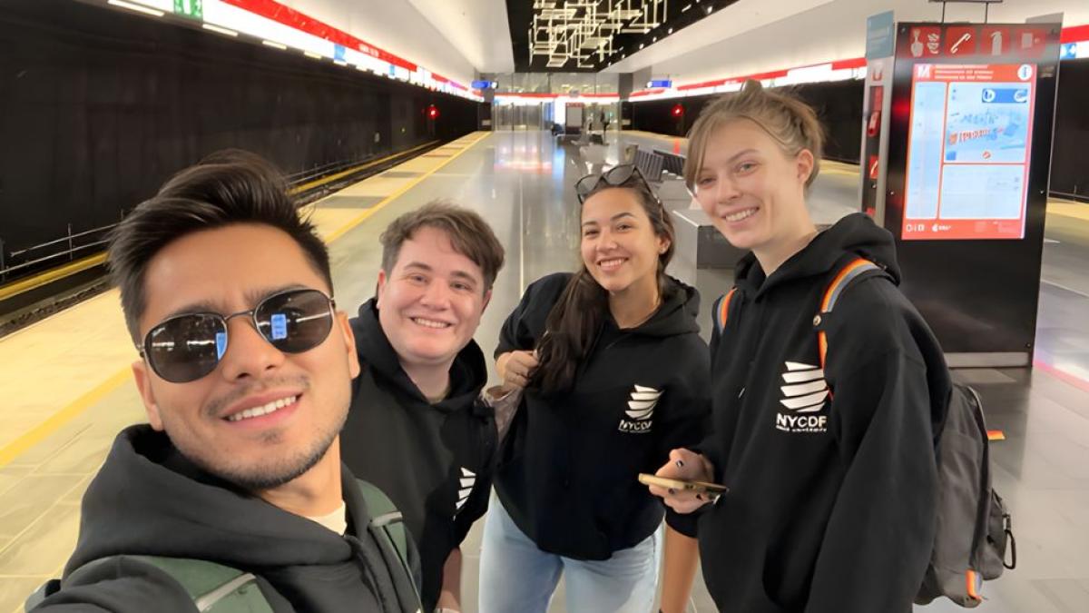 Pace Seidenberg team of students from the NYC Design Factory posing for a photo on a subway platform in Finland.