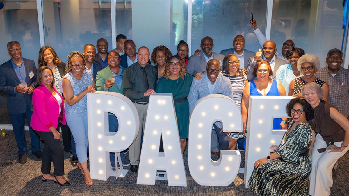 Group of Caribbean Pace alumni posing for the camera.