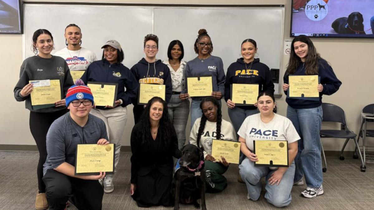 Group of students in the Pace University Criminal Justice and Security's Parenting, Prison, and Pups program holding certificates