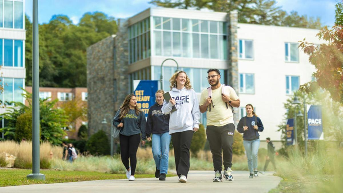 Pace University students walk down a path on the Westchester Campus
