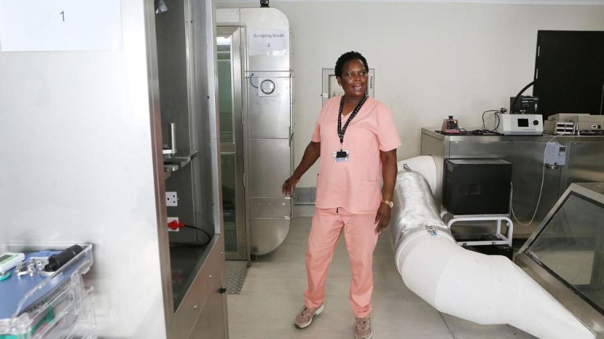 Nurse in pink scrubs in a hospital