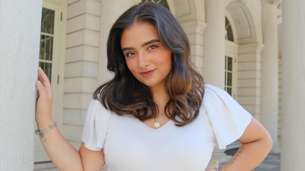 Alexis Pickering '26 posing on the front steps of NYC's City Hall.