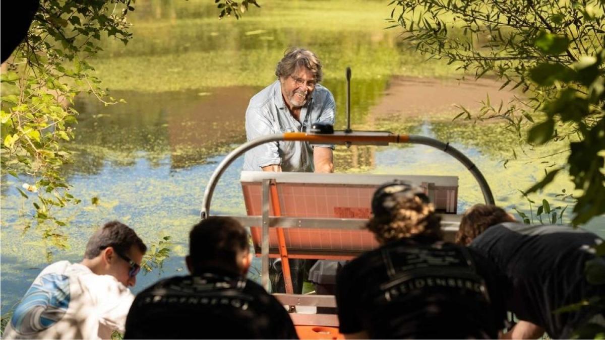 Seidenberg professor John Cronin teaches students at Pleasantville campus lake
