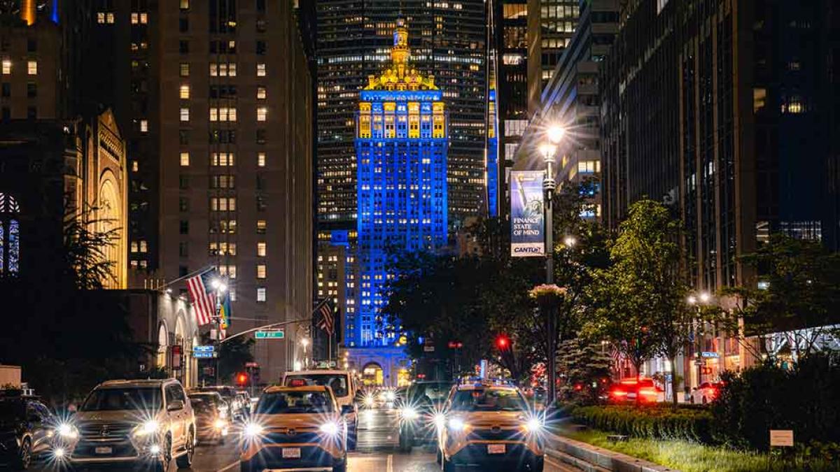 The Helmsley Building in NYC illuminated in blue and gold in honor of Pace's 120th anniversary year.