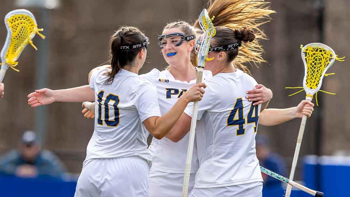 Pace University women's lacrosse athletes celebrate a win