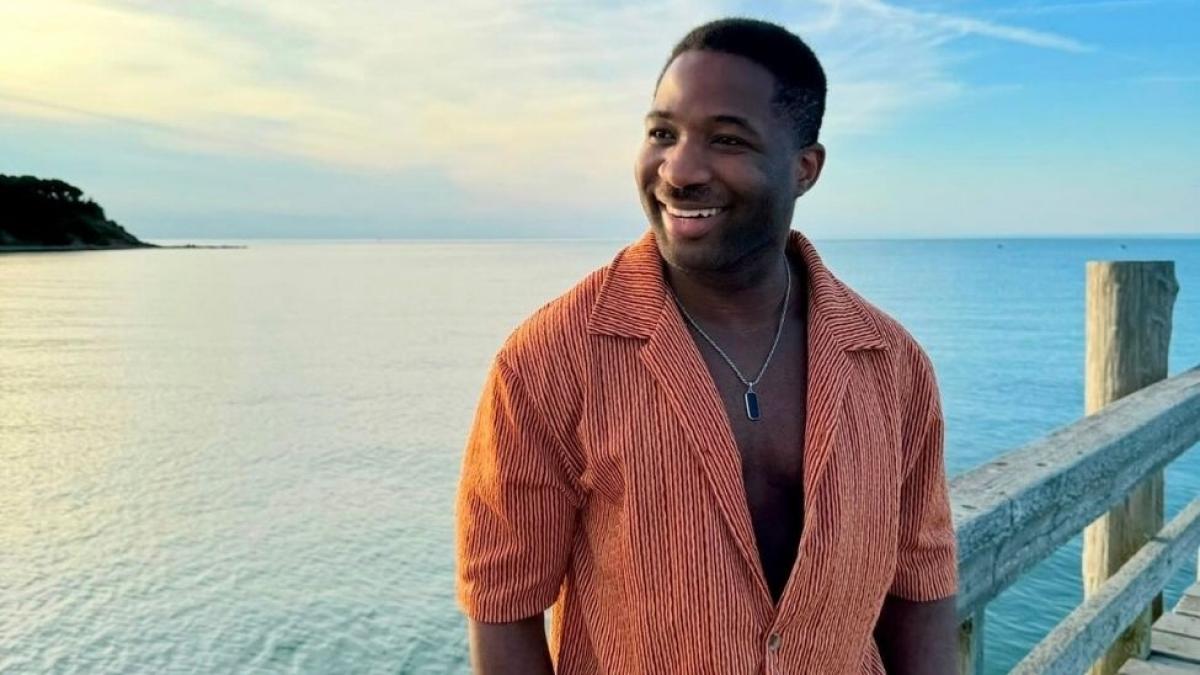 Seidenberg graduate Onye Ohiaeri on a pier overlooking the ocean