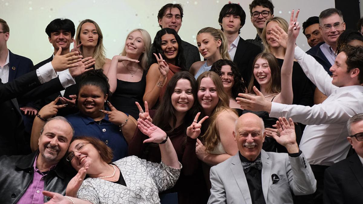 Pace University Economics students and faculty posing together at the annual department Gala