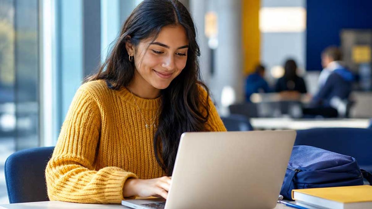 A student working at a computer.
