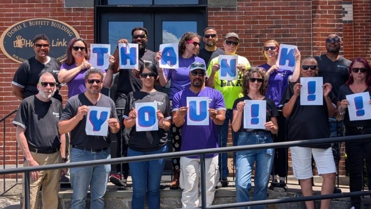 Hudson Link team celebrating with a thank-you sign