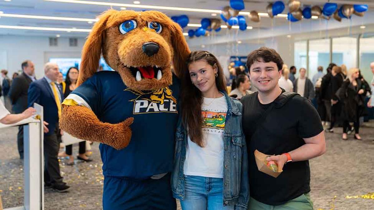 Pace University's mascot T-Bone poses with Pace students
