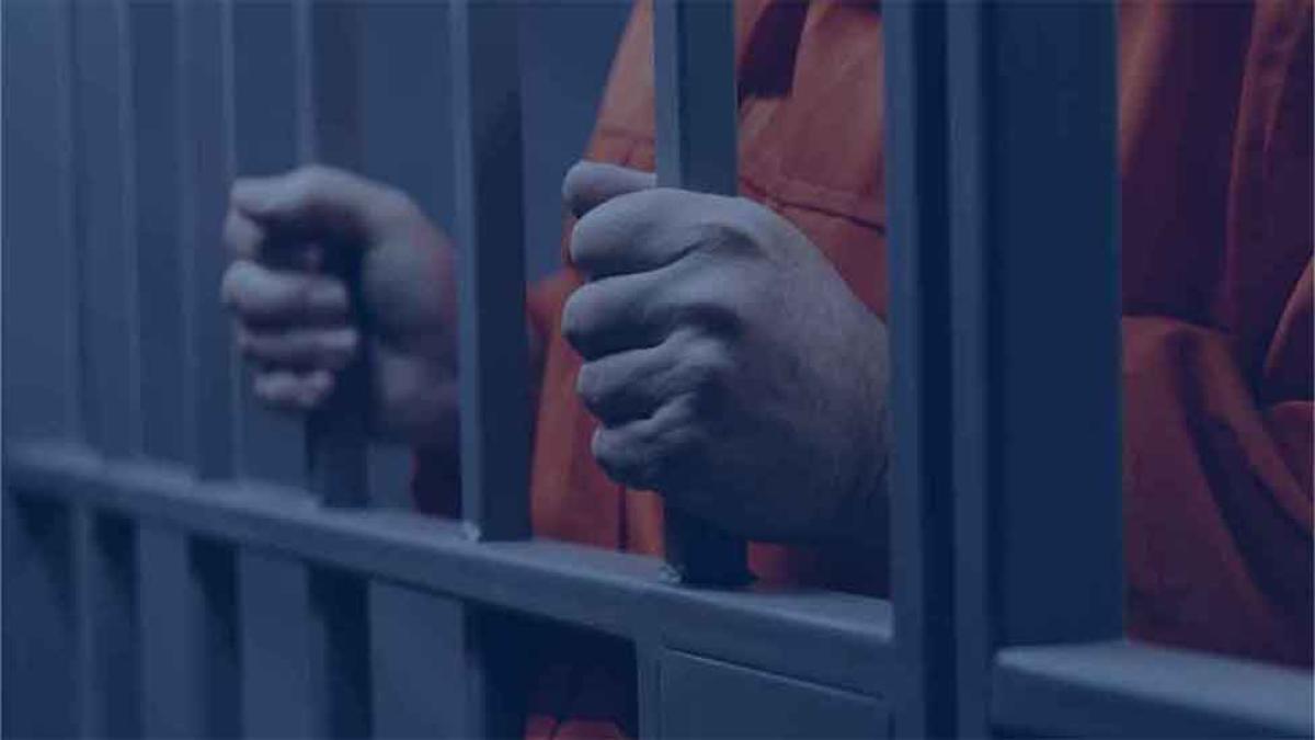 Graphic of a man in orange jump suite behind prison bars
