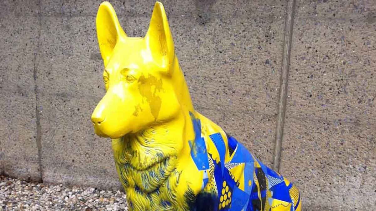 Close-up of the Setting the Pace canine statue.