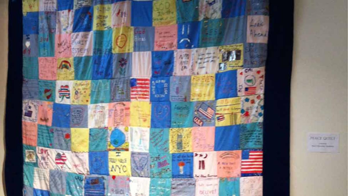 9/11 Remembrance Quilt hanged on a wall at Pace.