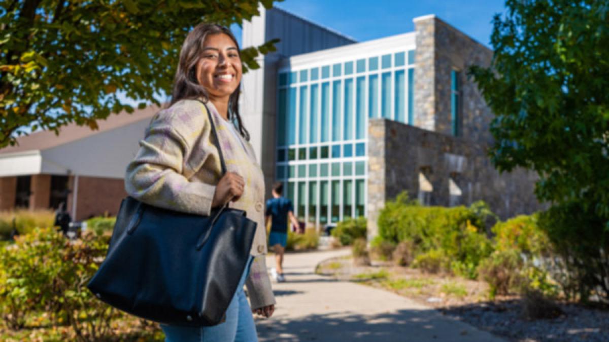 Pace Westchester student at the campus smiling