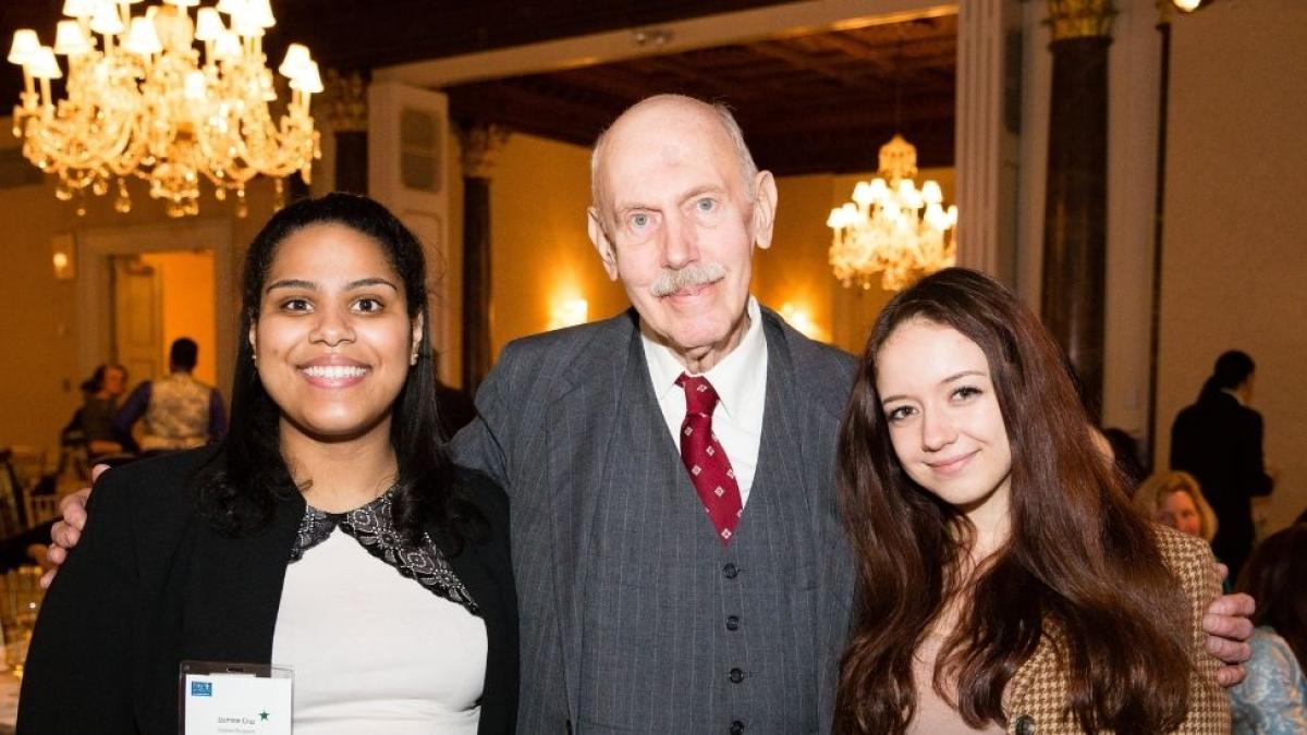 Henry Petermann '60 posing with scholarship recipients
