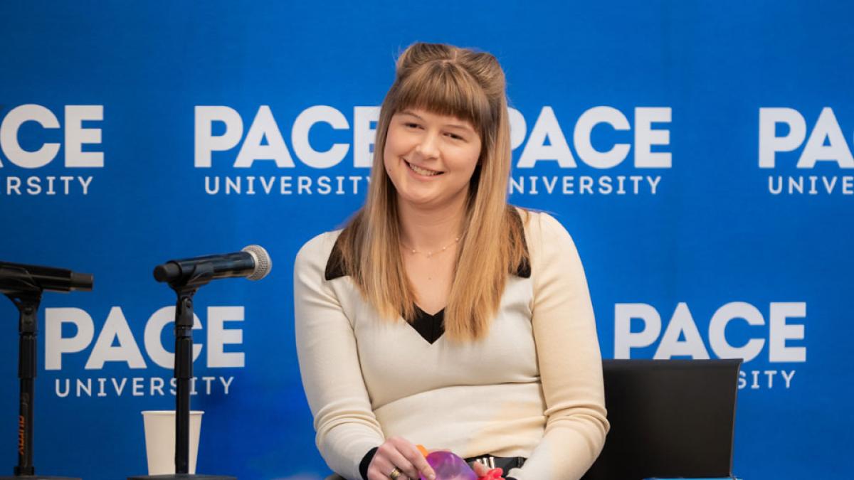 Kaelynn Partlow speaking to an audience at Pace.