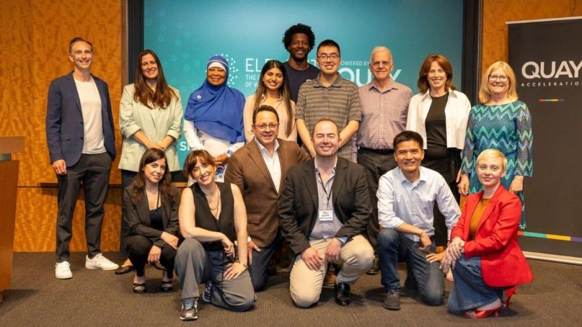 Averent team on stage at a tech accelerator event